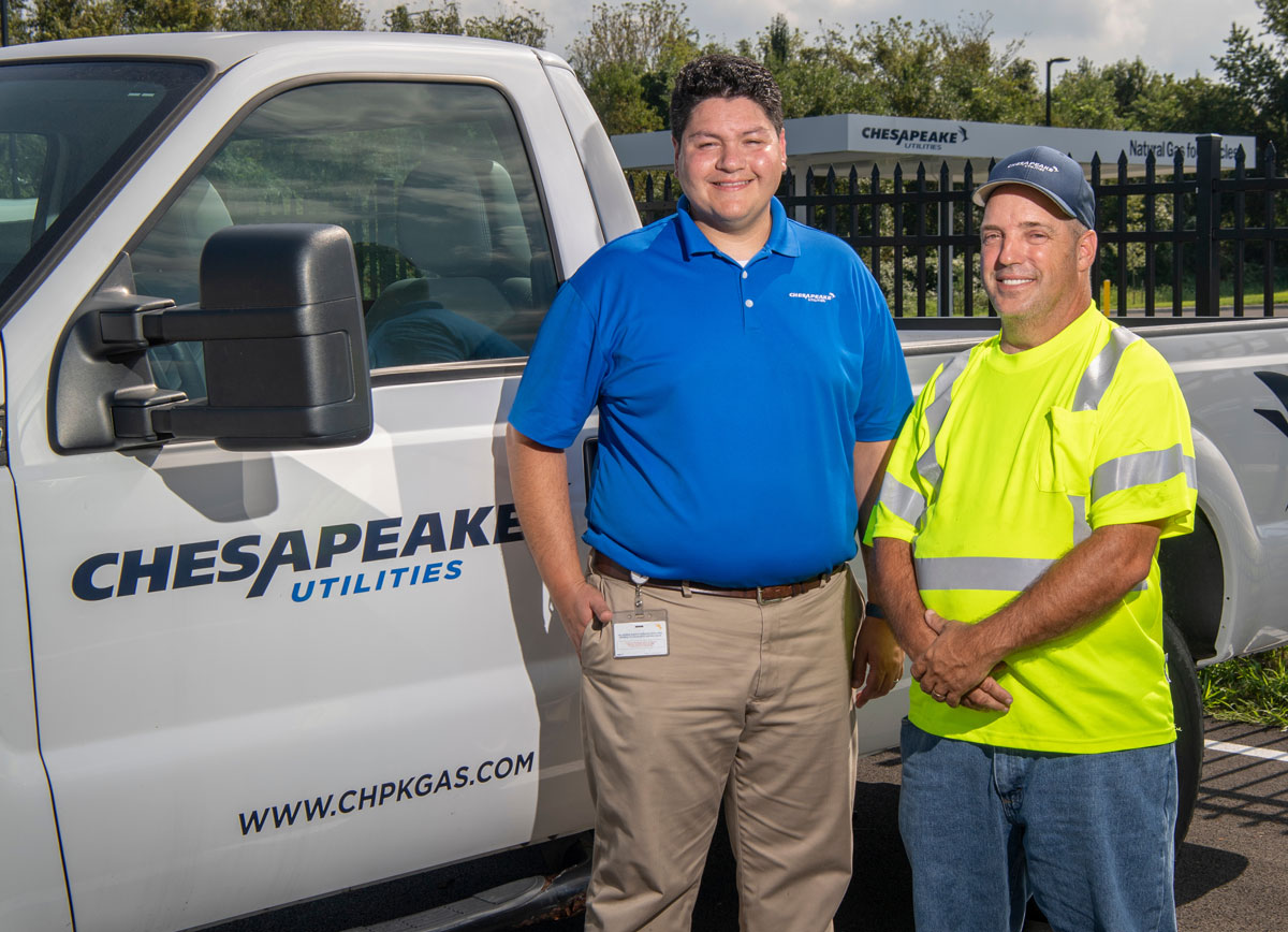 Chesapeake Utilities workers in front of truck